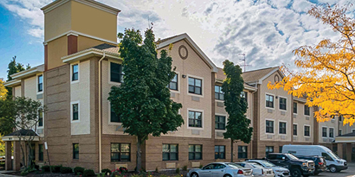 Exterior view of extended-stay hotel property acquired by Eternal Companies in CREModels underwriting case study